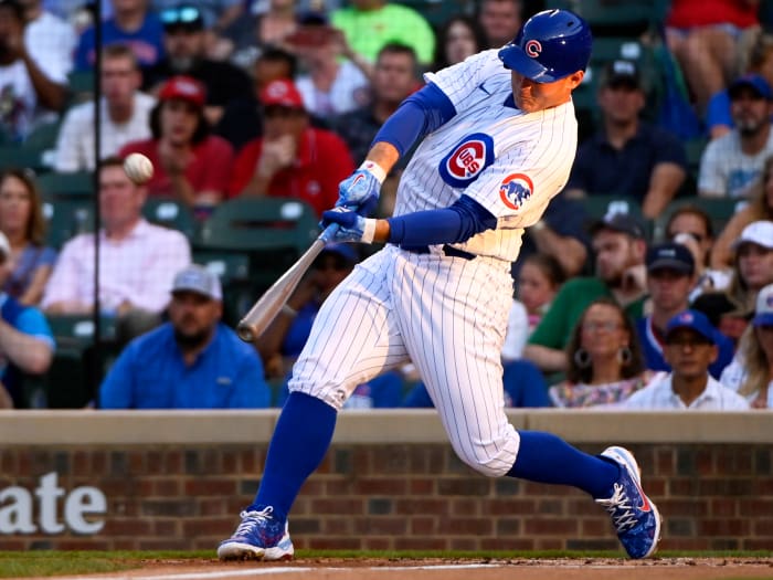 Jul 26, 2021; Chicago, Illinois, USA; Chicago Cubs first baseman Anthony Rizzo (44) hits a two run home run against the Cincinnati Reds during the first inning at Wrigley Field.